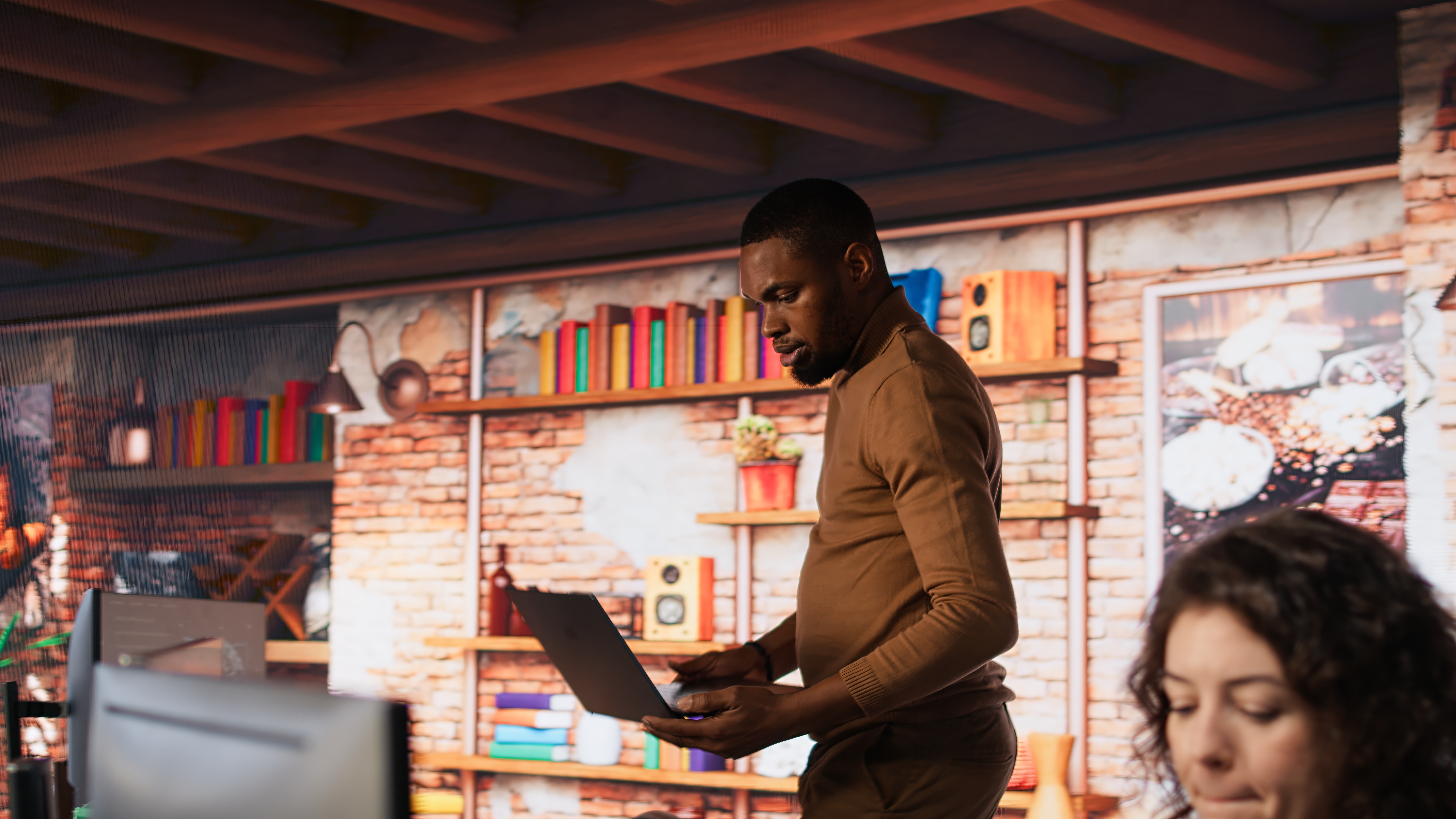 Artificial intelligence company worker arriving in the office with a laptop