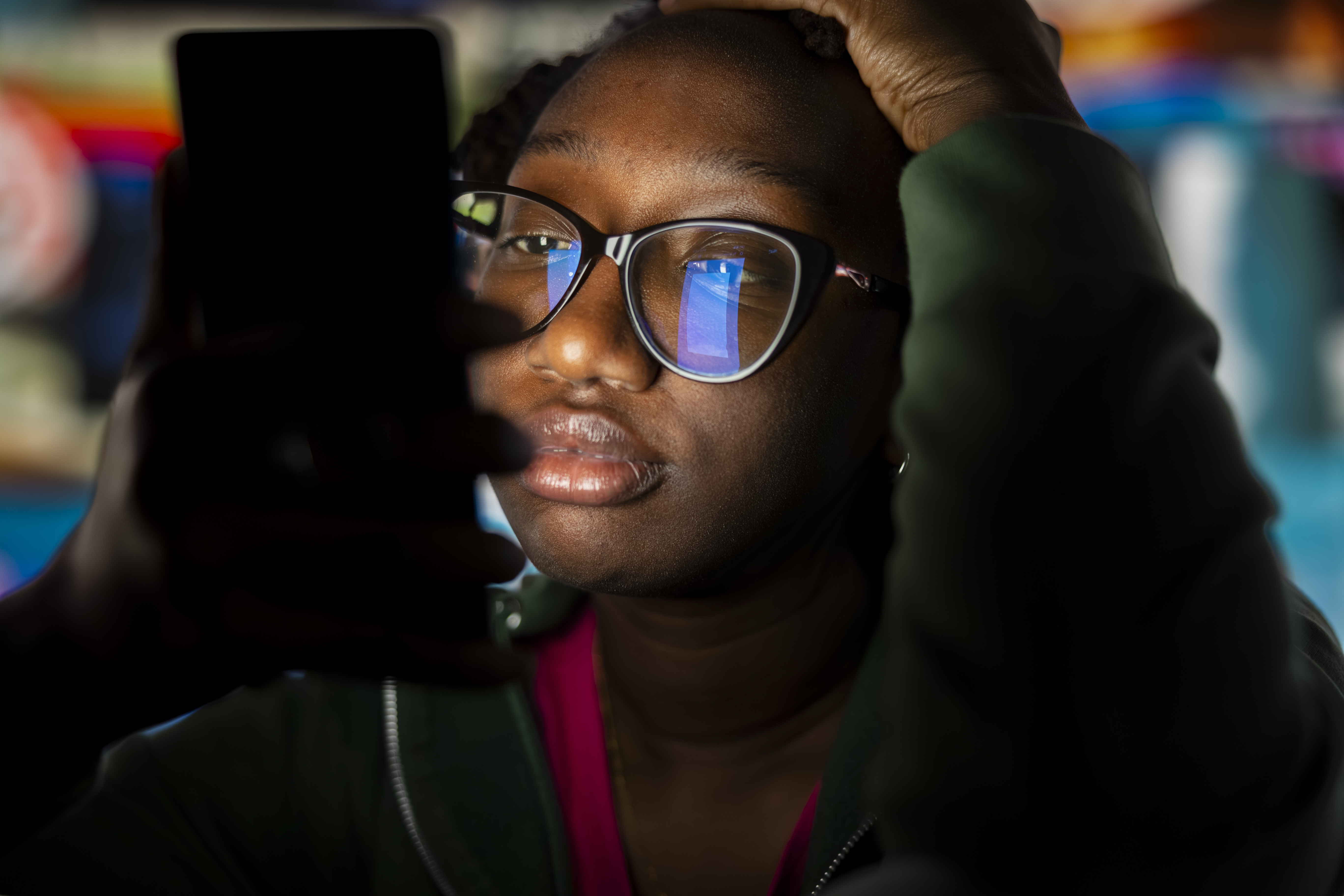 Closeup of a bored woman glued on smartphone enjoying leisure